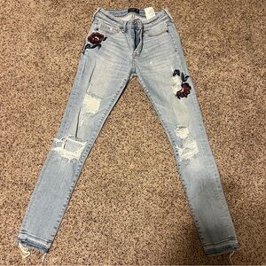 light wash jeans with flower detail size 26